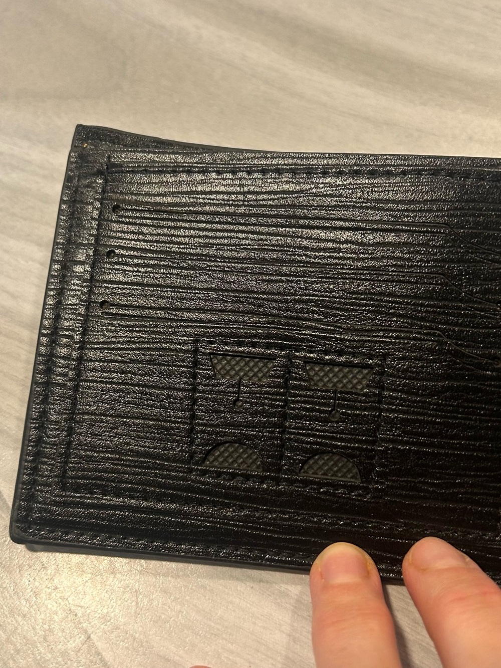 Men's Black Leather Bi-Fold Wallet with Embossed Face and Yellow Eye Accent - Picture 13 of 14